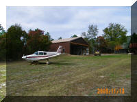 Cherokee Sitting Near Hangar